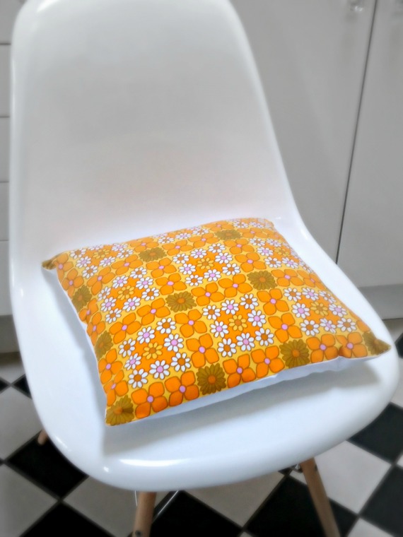 modflowers: golden cushion on an Eames