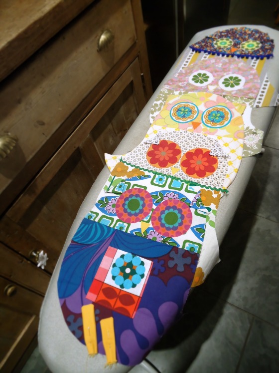 owl cushions on ironing board