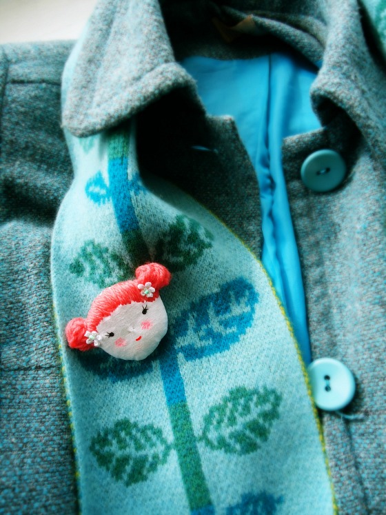 modflowers: doll face brooch on coat