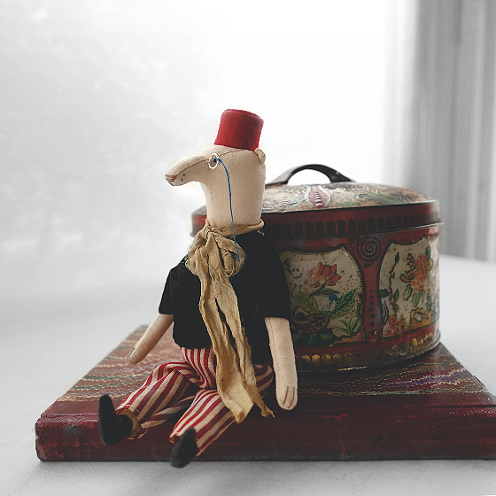 modflowers: winner by a nose - a long nosed bear doll wearing a fez and a monocle