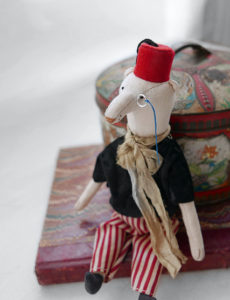 modflowers: winner by a nose - bear doll wearing a monocle and fez