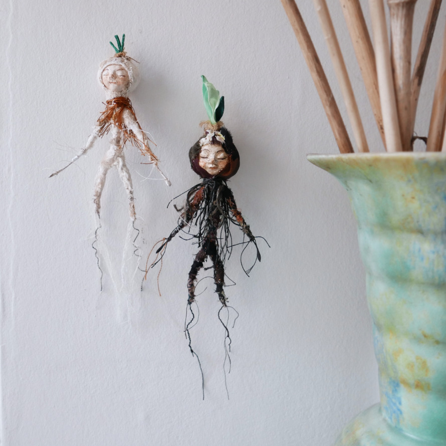 bulb boy dolls on wall by modflowers